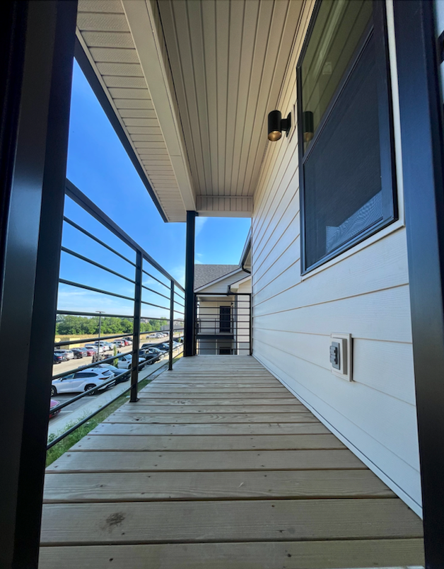 Balcony with view of property